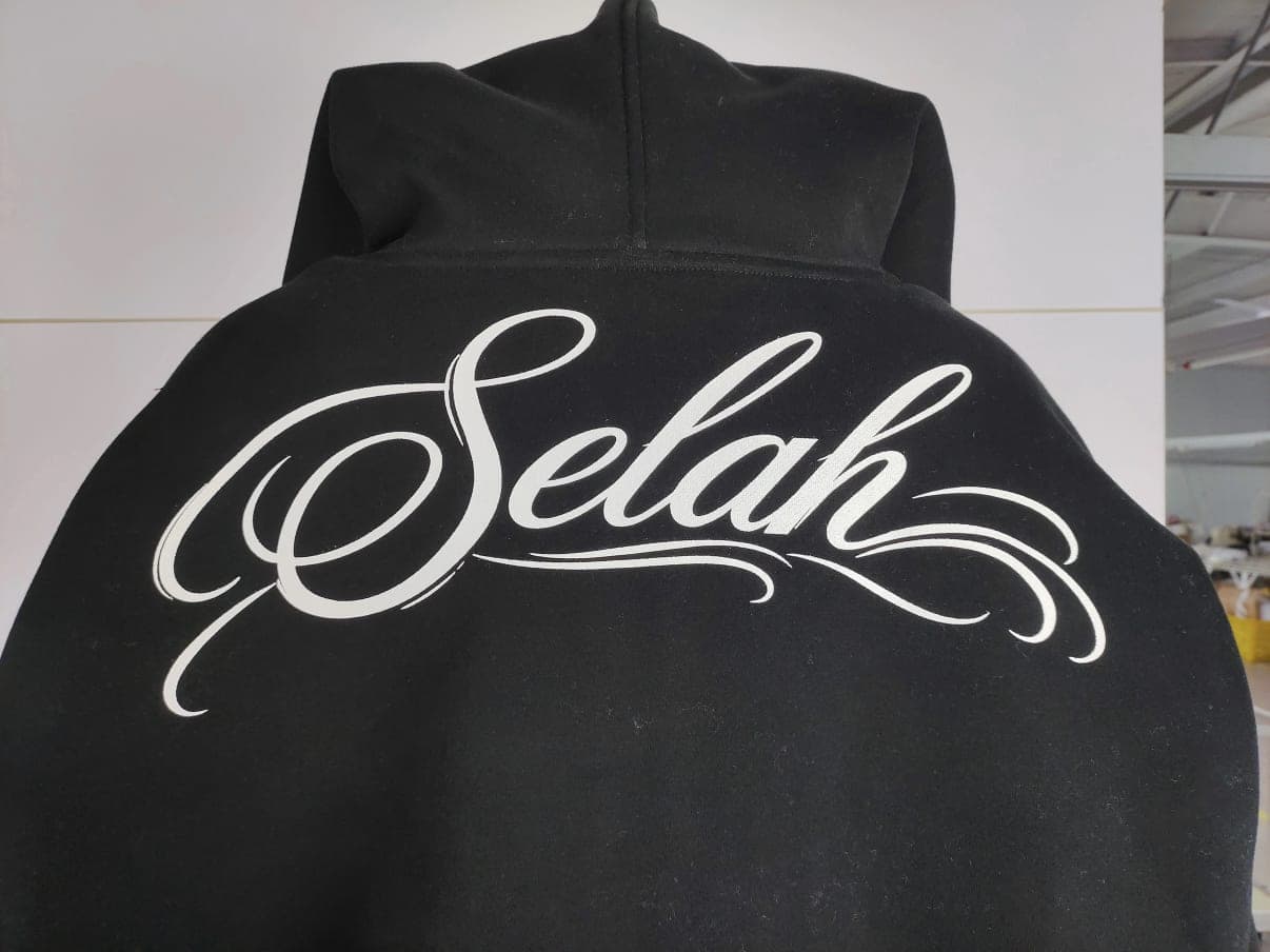 Selah script across the back of the hoodie